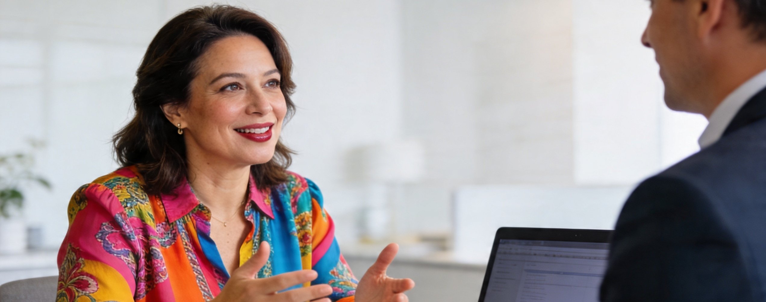 woman client explaining her goals to her financial advisor